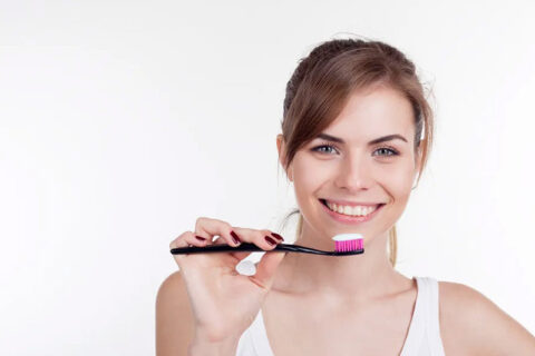 women using toothbrush